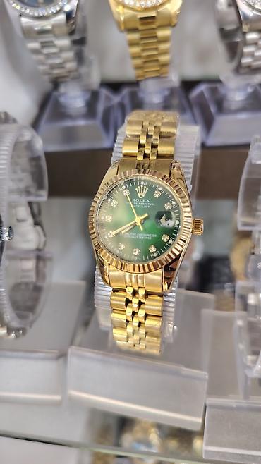 3d saat: Qızılı rəngdə klassik dizaynlı qol saatı - Model: “Oyster Perpetual — 5