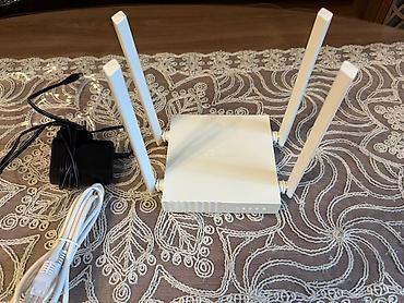 TP-Link Wi‑Fi router Arche C24 qutusu ile birlikde verilir -