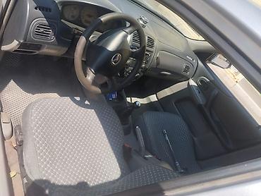 Унаа: Mazda 323: 2003 г., Кол менен иштөөчү, Бензин, Универсал — 5