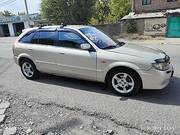 шторка фит: Mazda 323: 2003 г., 1.6 л, Механика, Бензин, Универсал — 2