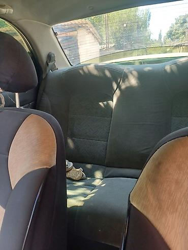 седло на даф: Daewoo Nubira: 1997 г., Механика, Седан — 4