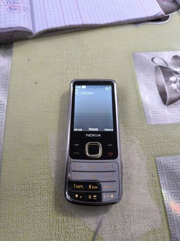 5 000 сомов только телефон доставка: Nokia 6700 Slide, Новый, 2 ГБ, цвет - Серебристый, 1 SIM