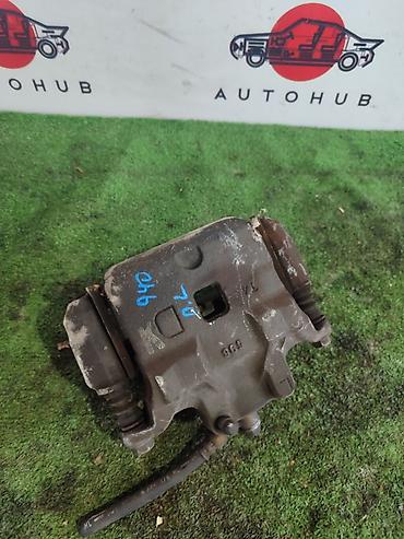 Суппорт тормозной передний левый для Nissan Teana J31, 2004 года