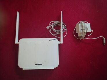 Ноутбуки: Nokia brendindən olan bu ağ rəngli Wi-Fi routeri iki xarici antenaya