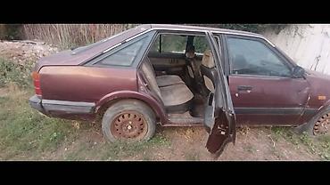ист крыло: Mazda 323: 1988 г., 2 л, Механика, Лифтбек — 2
