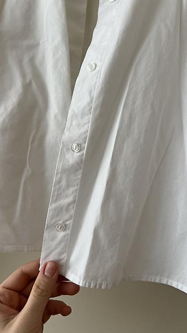Ziyafət donları: - Məhsul: Oversize T‑shirt - Brend/Qrafika: “NEW ERA” mövzulu çap; ön — 8