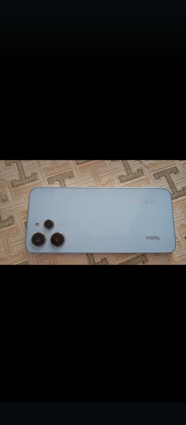telefon qusar: Xiaomi Redmi 13C, 256 GB, rəng - Mavi, 
 Zəmanət, Sensor, Barmaq izi