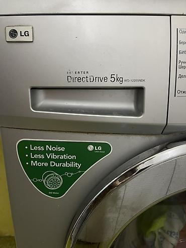 Elektronika: LG paltaryuyan maşın, ön yükləməli model. Üzərində “DirectDrive 5 kg” — 2