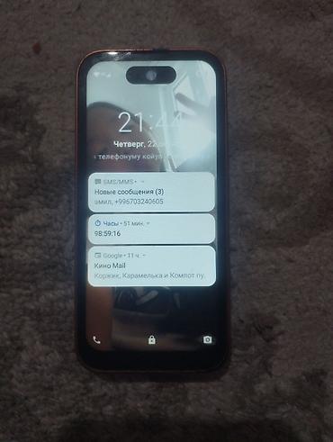 redmi note 19: Смартфон в оранжевом корпусе с плоскими гранями и блоком из трёх — 3