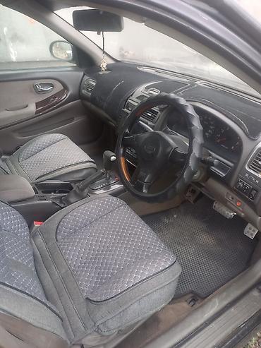 авто в такси: Nissan Primera: 2000 г., Автомат, Седан — 5