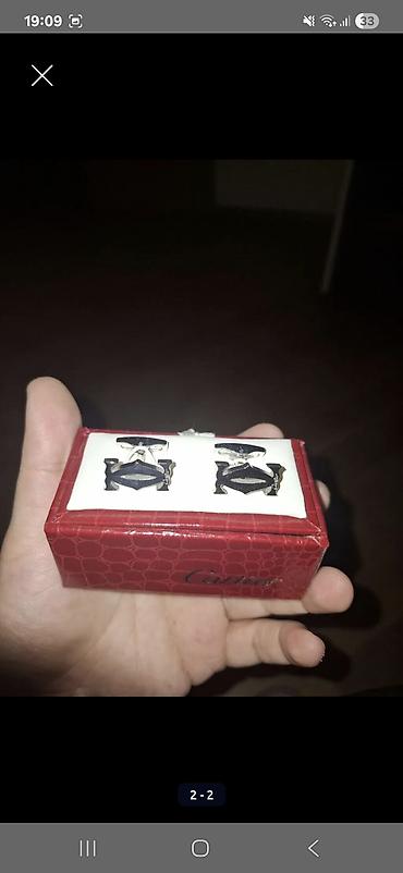 Bijuteriya: Məhsul: Kişi köynəyi üçün qol düymələri (cüt) Brend üslubu: Cartier — 1