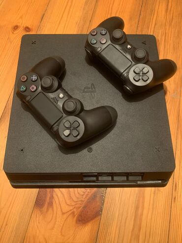 ps4 alışı: Ps4 Slim proşivka modelidir, 500gb yaddaş 7oyun var yaddaşda rdr 2,gta