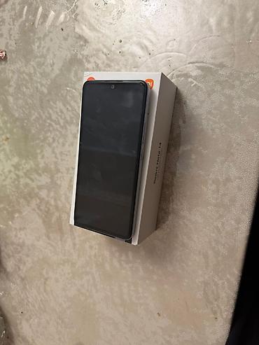 xioami 14: Xiaomi 14, 128 GB, rəng - Ağ, 
 Barmaq izi, Sənədlərlə, Face ID — 1