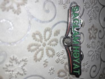 həsir cantalar: Məhsul: “Sağlam Həyat” nişanı Xüsusiyyətlər: - Material: Metal — 1