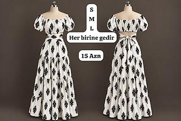 Ağ rəngli, qara naxışlı maxi don. Qısa şişik qollar, açıq çiyin
