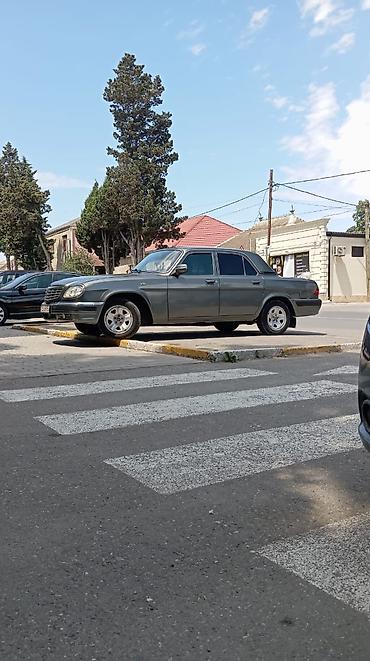 volga 2110: GAZ Volga 31105 sedan - Kuzov: 4 qapılı sedan, tünd boz rəng, xrom ön — 7
