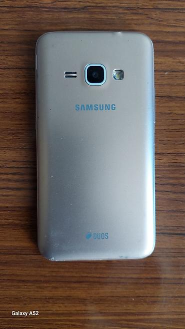 07 şekilleri indir: Samsung Galaxy J1 2016, 8 GB, rəng - Qızılı — 2