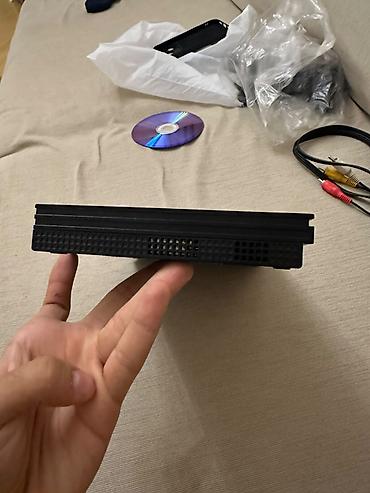 ps2 diskləri: PlayStation 2 Slim oyun konsolu. Kompakt və nazik korpusa malik PS2 — 4