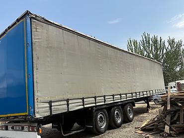 Полуприцеп‑тент Krone, трехосный - Тип: тентованный (шторный) — 1