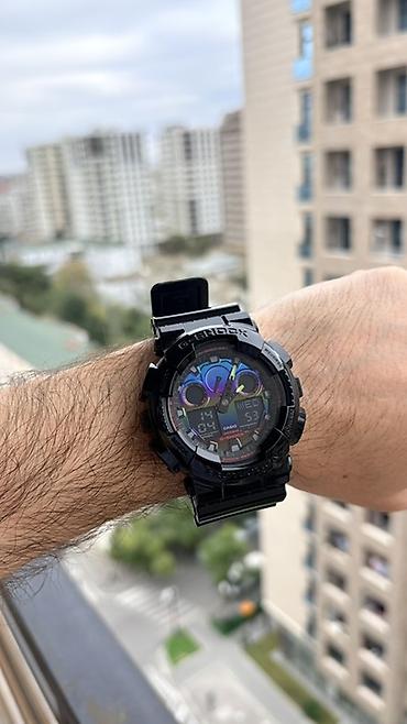 g shock: Casio G-Shock qol saatı. Qara rəngli, iri korpuslu və idman üslublu — 7