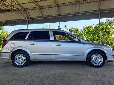 фольксваген тигуан л с: Opel Astra 1.3 turbo dizel (universal) – gümüşü rəngdə, 5 qapılı — 4