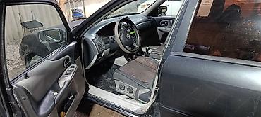 велоприцеп для детей: Mazda 323: 2002 г., Механика, Дизель, Хэтчбэк — 5
