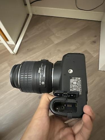 Зеркальная камера Nikon D3100 с объективом AF-S DX NIKKOR 18–55mm