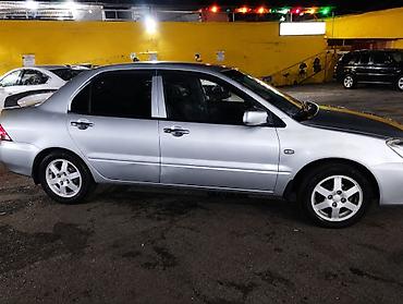 balaca maşın: Mitsubishi Lancer: 1.6 l | 2007 il 280 km Sedan — 3