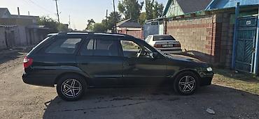 япония машина: Mazda Capella: 2000 г., 2 л, Механика, Бензин, Универсал — 8
