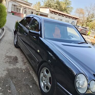 блины на мерс: Mercedes-Benz E‑Class W210, черный седан. Основные особенности: -