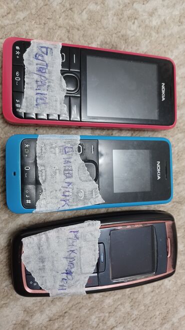 Другие мобильные телефоны: Телефоны мобильные с различными недостатками.написаны на бумаге. по