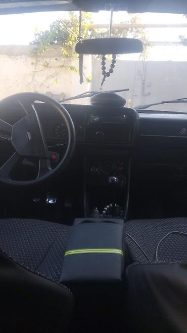e60 guzgu: LADA 2107 sedan təqdim olunur. Avtomobil qara rəngdədir və klassik — 6