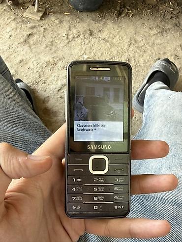 kontakt iphone 15 pro: Samsung S5610, rəng - Qara, Düyməli — 4