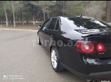 Volkswagen: Volkswagen Jetta: 2 l | 2009 il Sedan — 2