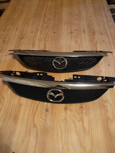 брызговики универсальный: Решетка радиатора Mazda