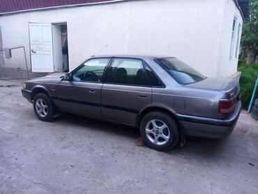 рага на авто: Mazda 626: 1991 г., 1.8 л, Механика, Бензин, Седан
