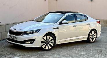 Kia: Kia Optima – ağ rəngli sedan Xarici xüsusiyyətlər: - Şık ağ kuzov — 4