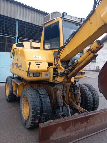 электр мотоцикл: Экскаватор, Komatsu, 2001 г., Дөңгөлөктүү