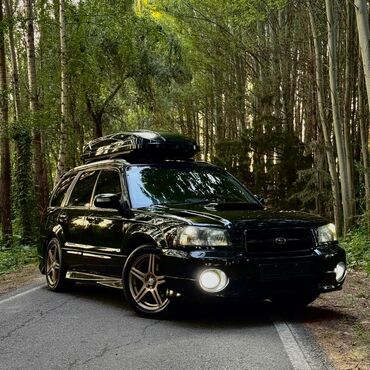 кузовной домкрат: Subaru Forester STI (кузов SG) — черный универсал с акцентом на