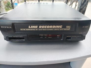 fisher televizor: SUPRA SV-95DX modeli qara rəngdə, "LINE RECORDING" funksiyalı VHS