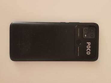 alcatel 9005x: Смартфон POCO (черный цвет). На задней панели — модуль основной камеры — 1