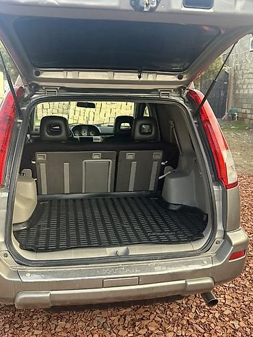 99 masin: Nissan X-Trail kompakt SUV modeli. Şəkillərdən göründüyü kimi gümüşü — 5