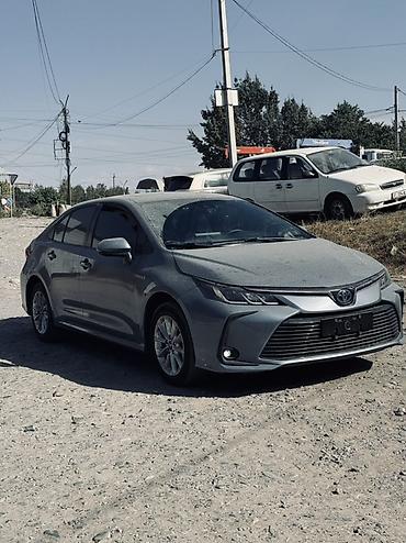 byd e1: Toyota Corolla: 2021 г., 1.8 л, Вариатор, Гибрид, Седан — 1