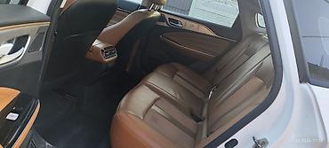 GAC: GAC Aion S — современный электрический седан белого цвета. Зопас хода — 6