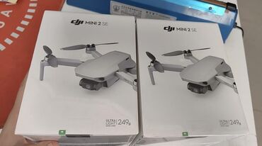 Дроны: Компактный дрон DJI Mini 2 SE в комплекте. Легкий и удобный в
