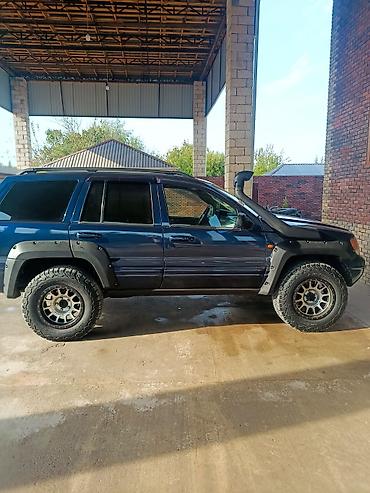 ekskavator satisi bakida: Jeep Grand Cherokee (WJ) off-road təkmilləşdirilmiş SUV Xarici: - — 2