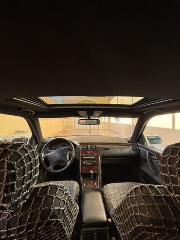 Mercedes-Benz: Mercedes-Benz E-Class (W210) sedan, gümüşü rəng. - İkiqat dairəvi ön — 9