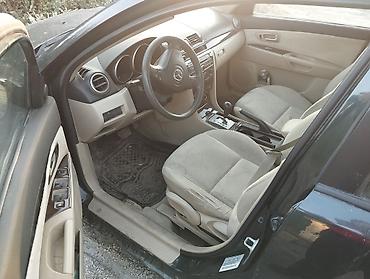 Mazda: Mazda 3, седан (поколение BK). Цвет темно‑серый/черный. Бензин автомат — 4