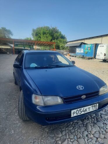 афто киридит: Продается автомобиль Toyota Corona синего цвета. Эта модель известна
