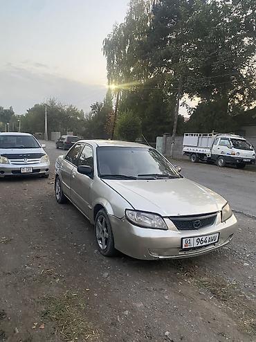 Mazda 323: 2001 г., 1.5 л, Автомат, Газ, Седан